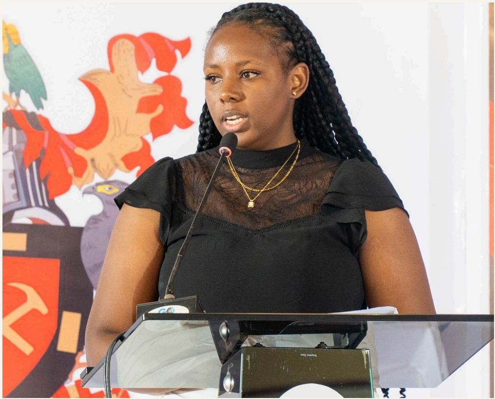 Wambui Kung'u presenting at a podium